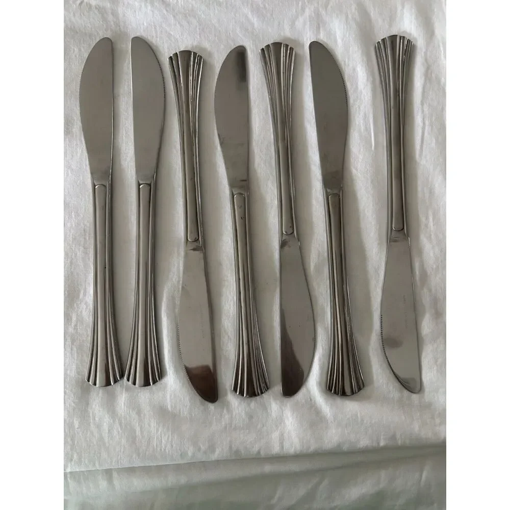 Stainless steel flatware. 7 pieces knives not sure of brand or style very heavy.